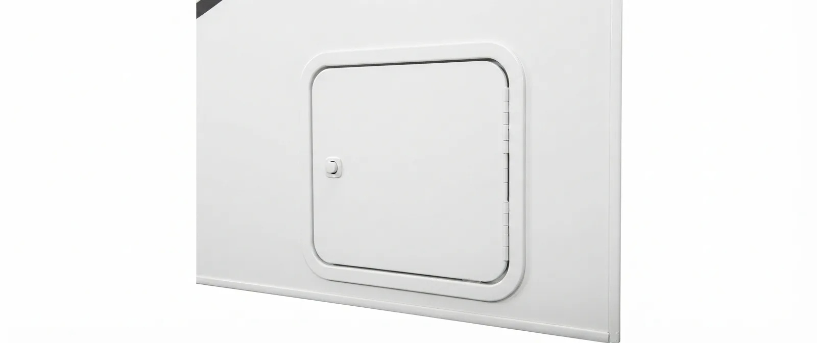 A hinged access door on an RV exterior wall — the cutout and vent geometry a tankless retrofit has to meet
