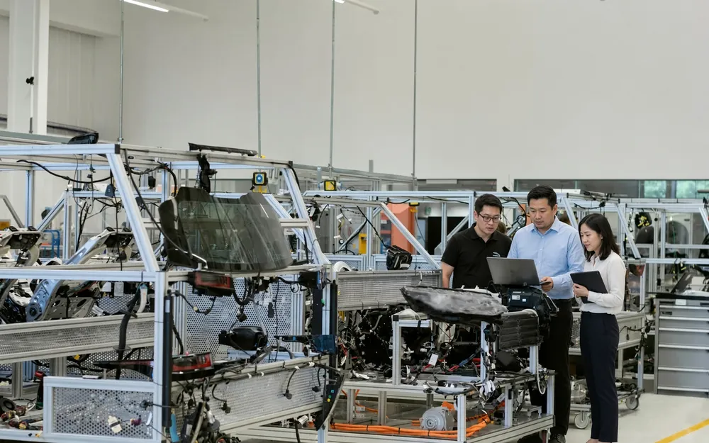 Engineers reviewing an assembly on the line at Gulfstone's plant