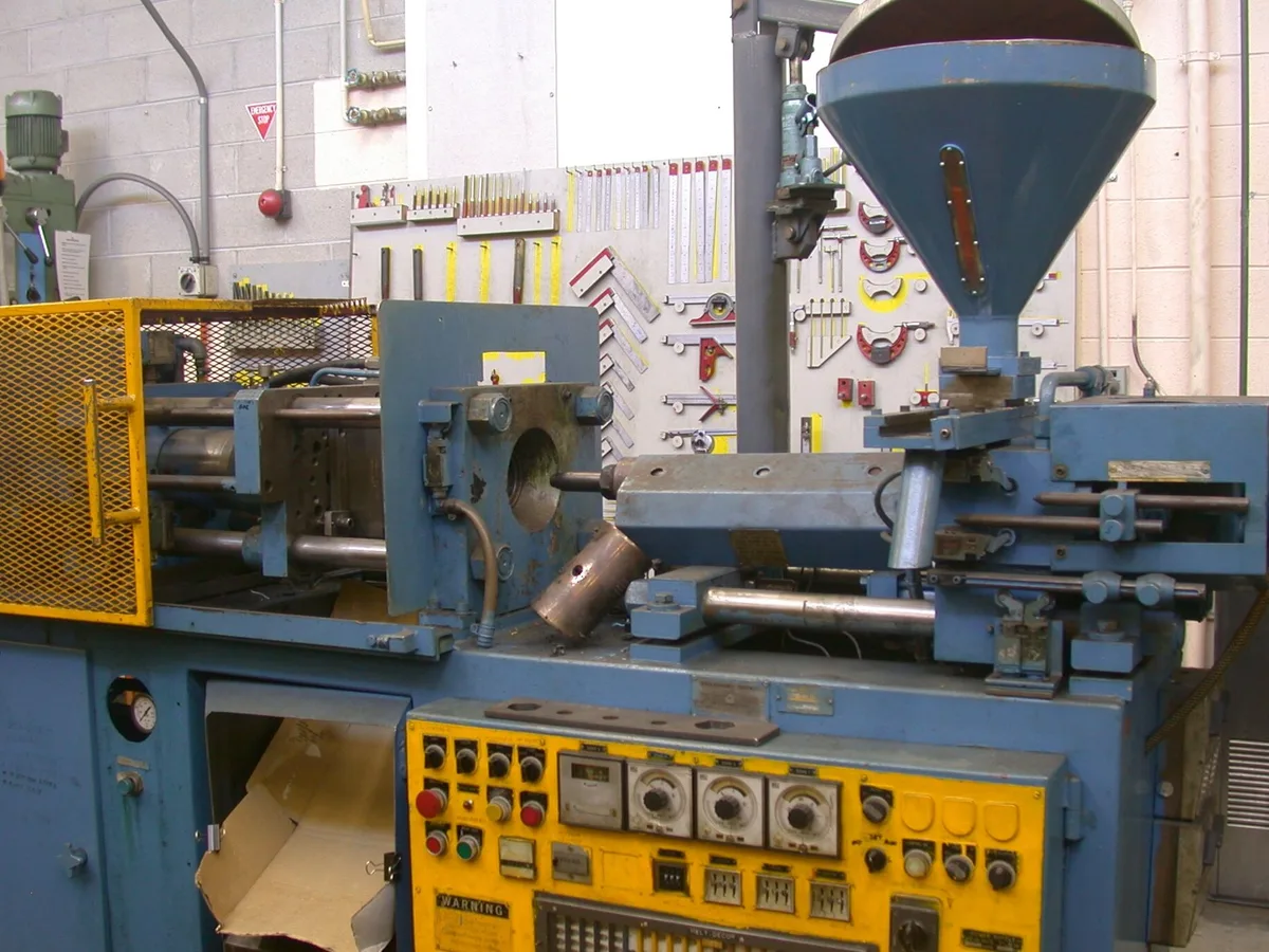 The tooling half of an injection press with the mould mounted and clamped